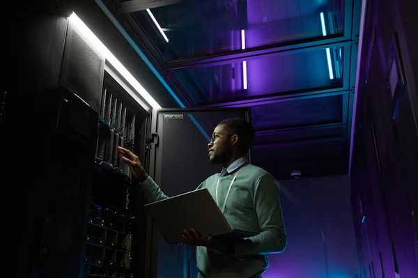 Engineer working in a server room