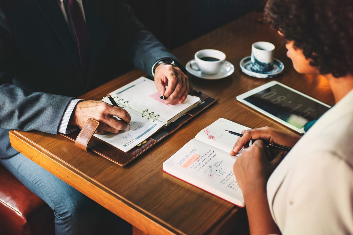 Consultants meeting with a client