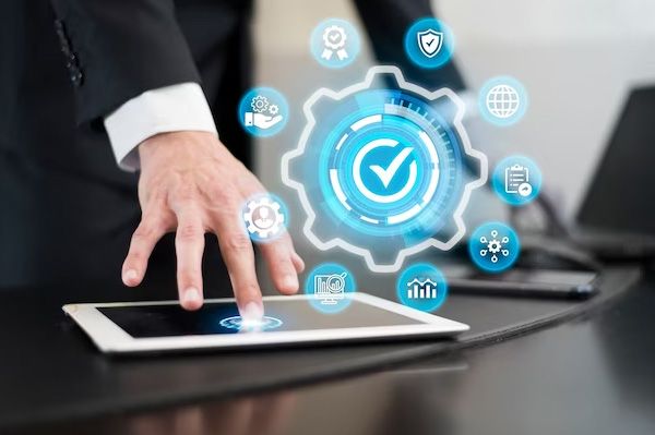 Hand on a tablet with connected-device icons