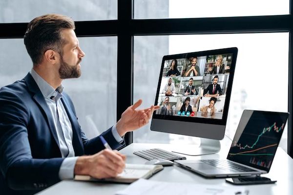 Man on a video call with several participants